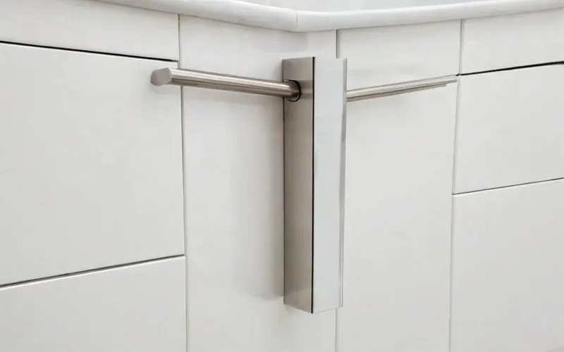 close-up of cabinet door with gloss white finish and T-bar handle