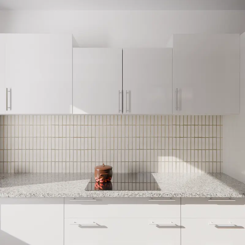 Gloss white wall cabinets with a rangehood cabinet above a black induction cooktop, a vertical-tile splashback and a grey granite benchtop