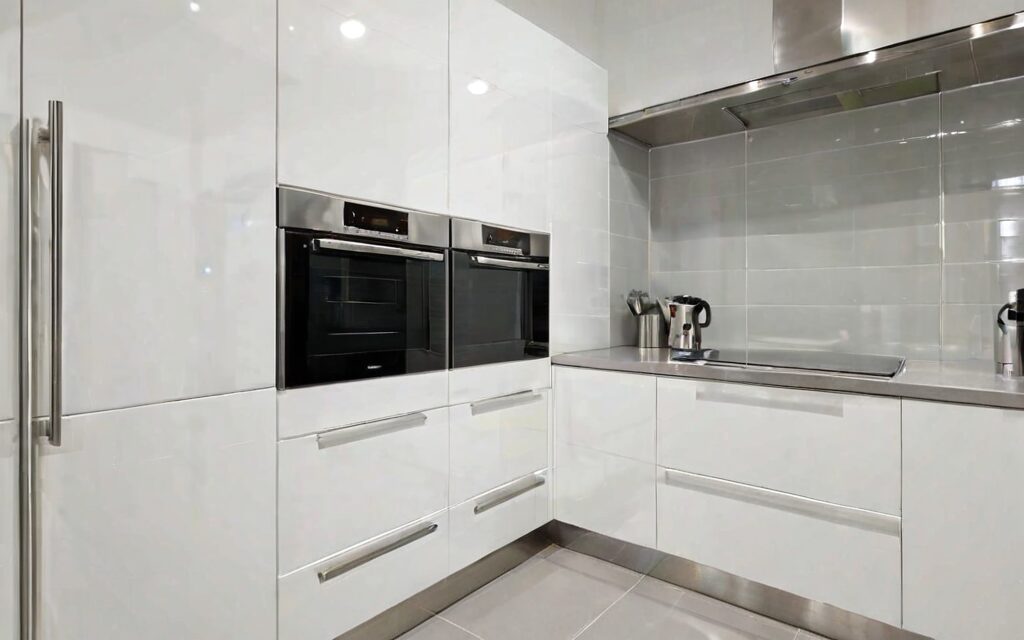 laundry cabinet with T-bar handles and soft-close drawers