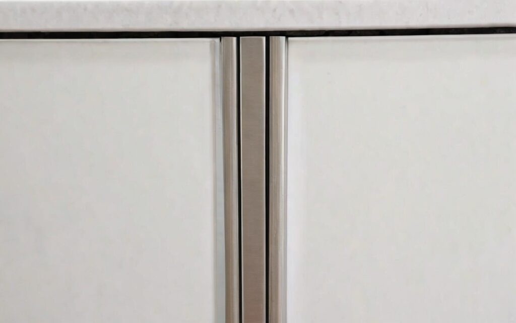 close-up of cabinet with T-bar handle and soft-close drawer